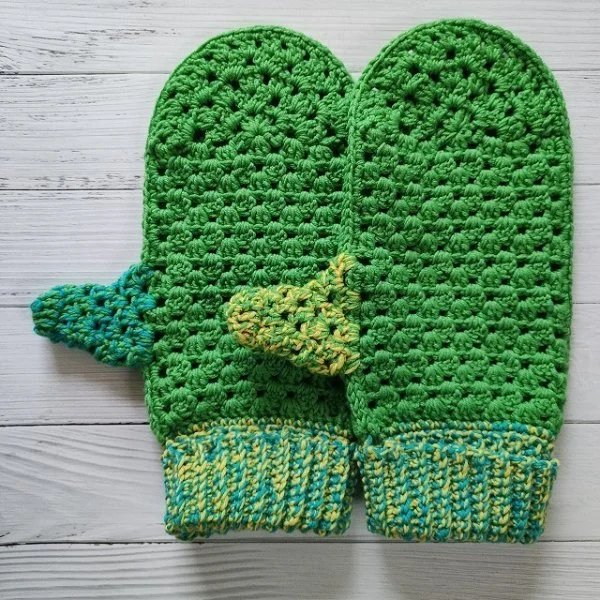 Bright green crochet mittens made in the granny stitch.