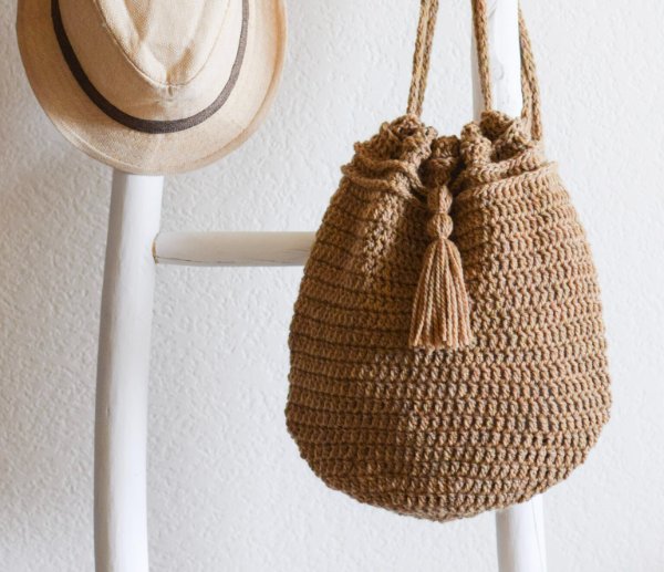 A crochet drawstring backpack.