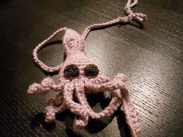 A crochet squid cat toy.