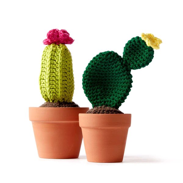 Crochet cacti in terracotta pots.