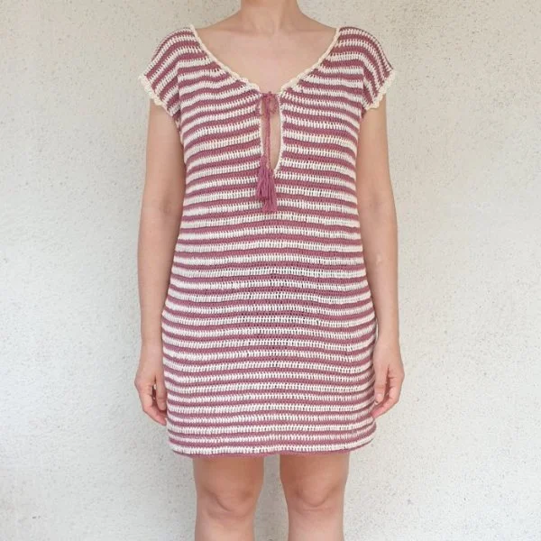 A close up of a casual striped crochet dress.