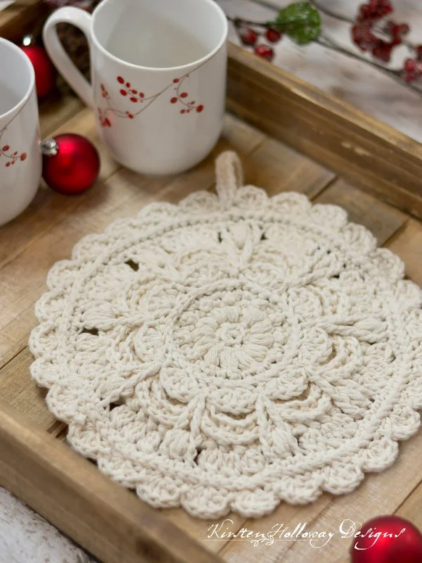 Lacy round crochet trivet.