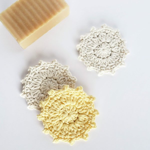 Yellow and white crochet face scrubbies with picot edging.