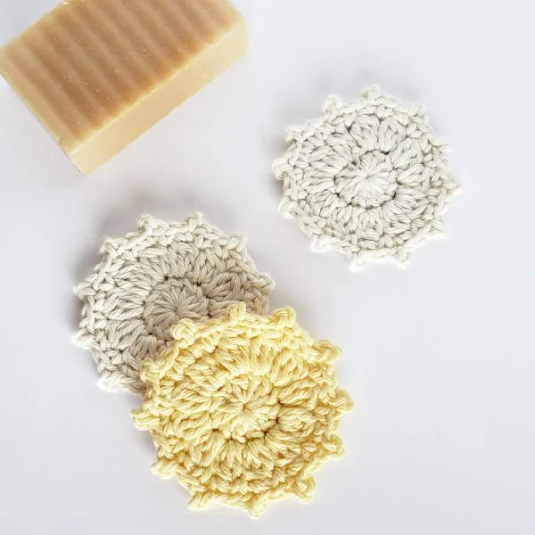 Yellow and white crochet face scrubbies with picot edging.