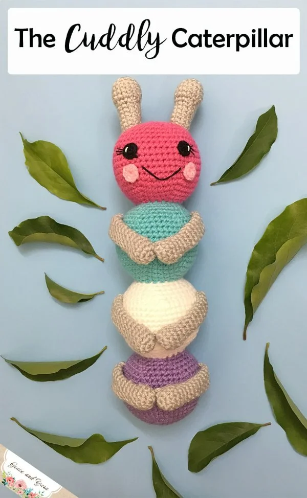 A crochet caterpillar on its back.