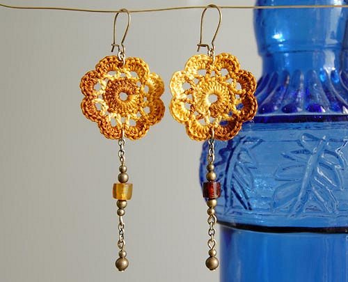 Long, dangly crochet flower earrings with beads.