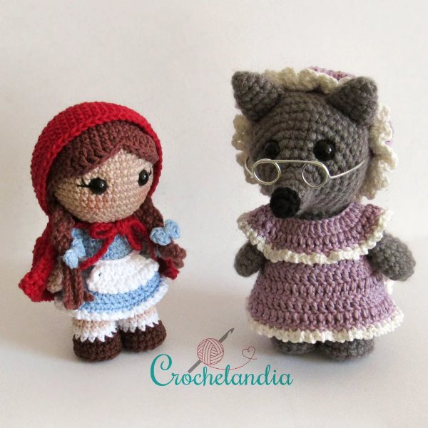 A crochet wolf dressed as the grandma from Little Red Riding Hood.