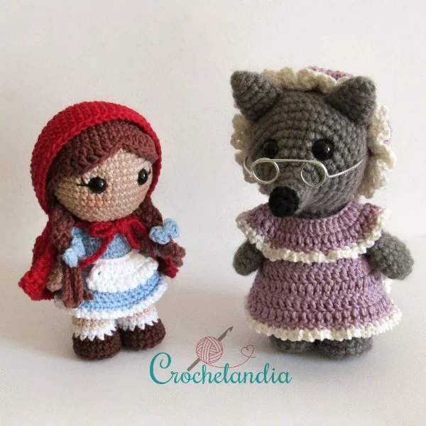A crochet wolf dressed as the grandma from Little Red Riding Hood.