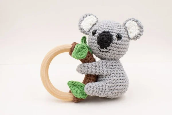 A crochet koala amigurumi teething ring.