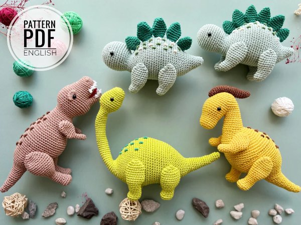 A group of crochet dinosaurs.