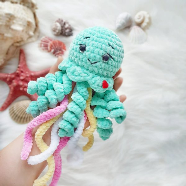 A cute crochet octopus made in velvet yarn.