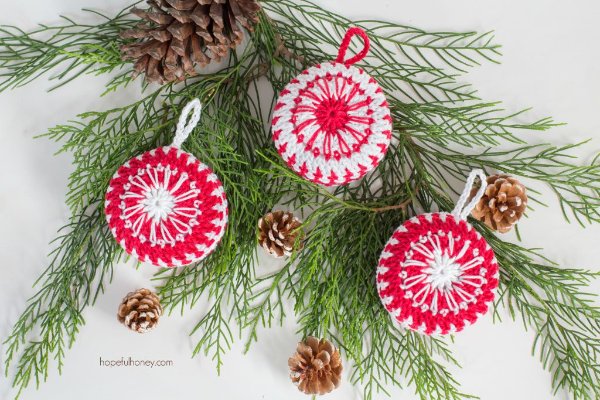 Crochet Christmas Babubles with a candy cane theme.