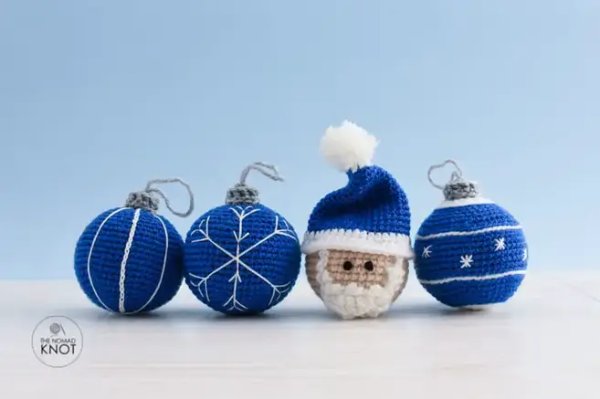 Blue and white crochet baubles plus a blue and white santa bauble.