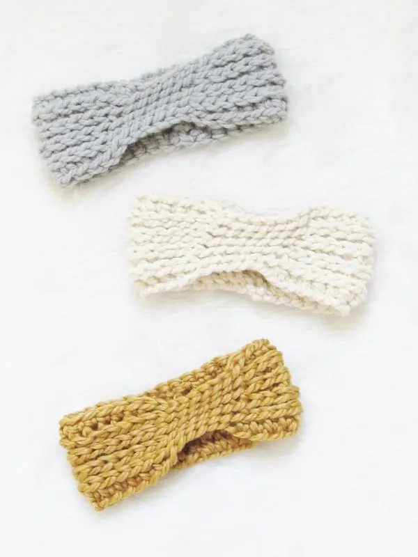 Three chunky crochet headbands in different colourways.