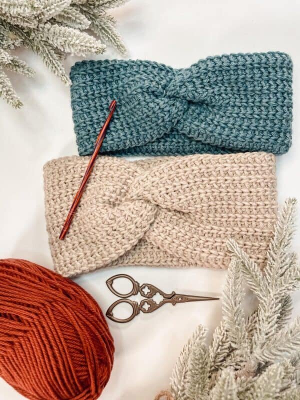 Two different coloured crochet earwarmer headbands.