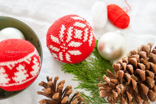 A red and white crochet CHristmas bauble worked with the Fair Isle colourwork technique.
