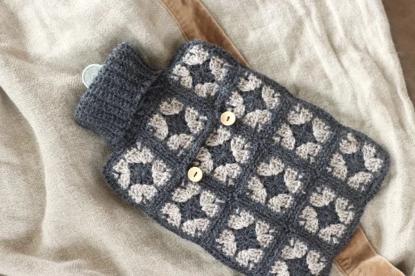 An image of the finished back of the granny square hot water bottle cover.