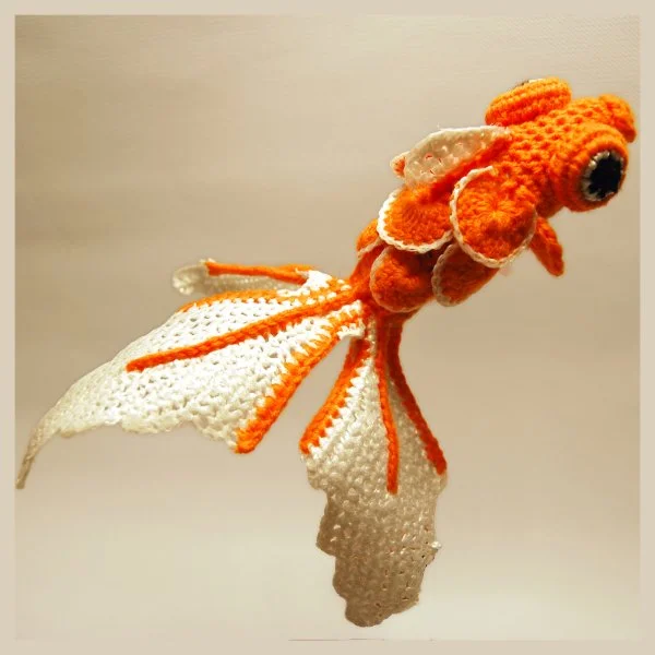 A realistic looking crochet goldfish.