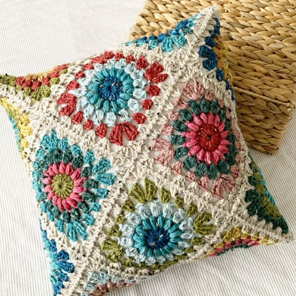 Multicoloured crochet granny square pillow.