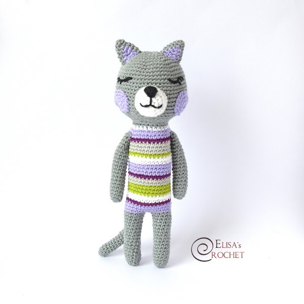 A standing crochet cat with a striped belly.