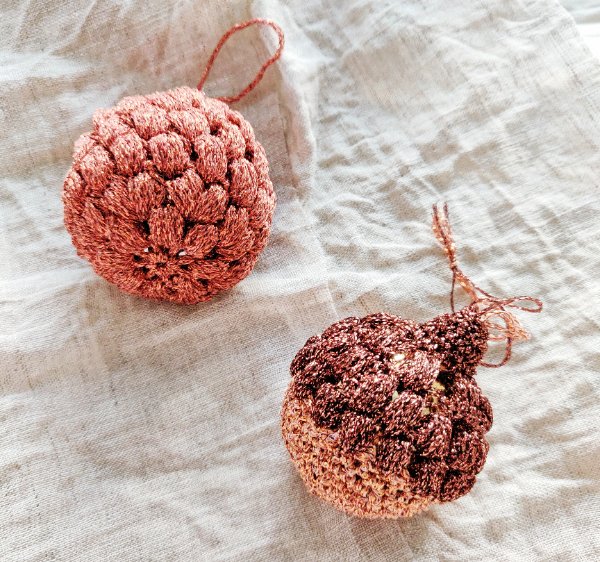 Two puff stitch crochet bauble ornaments.