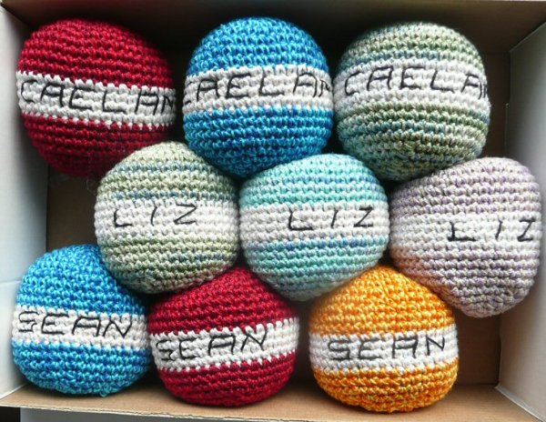 A collection of crochet stress balls.