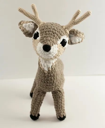 A cute crochet deer plushie.