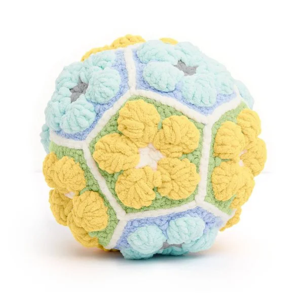 A crochet ball made with floarl pentagon motifs.