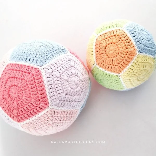 A crochet ball made with pentagon motifs.