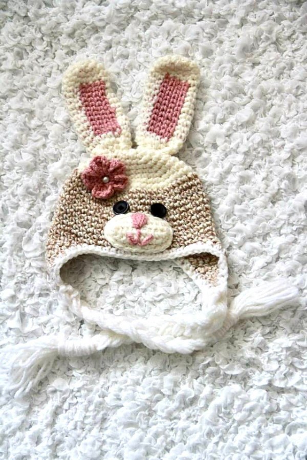 Crochet bunny hat with flower decoraton.