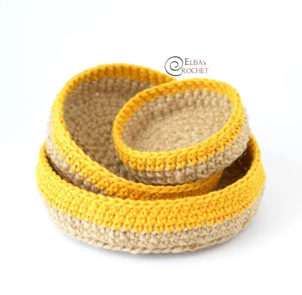 A set of yellow and jute crochet nesting bowls.