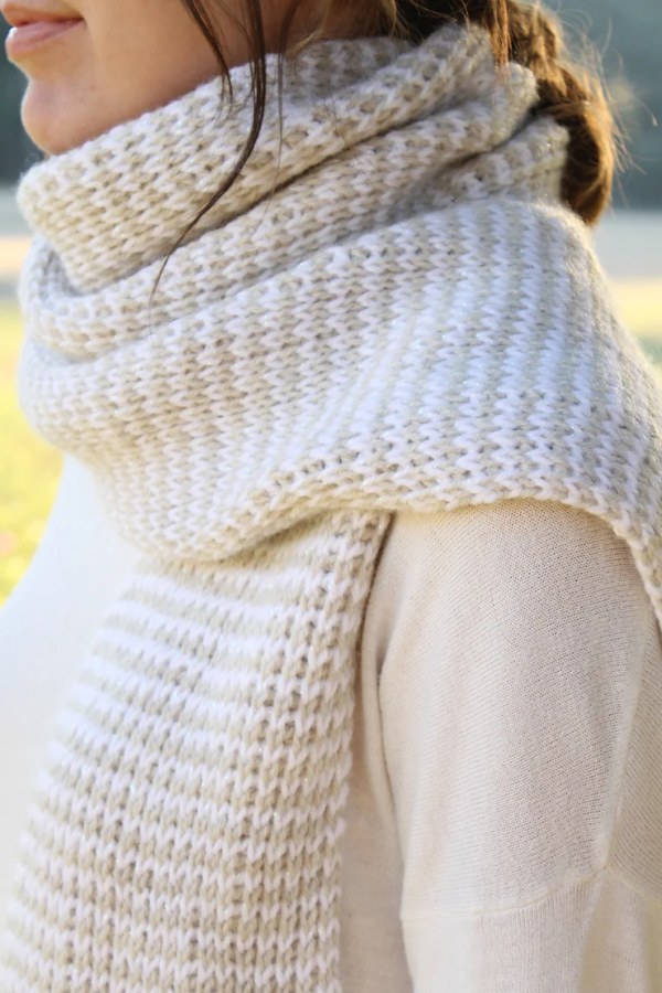 A  close-up of a cream coloured Tunsian crochet scarf.
