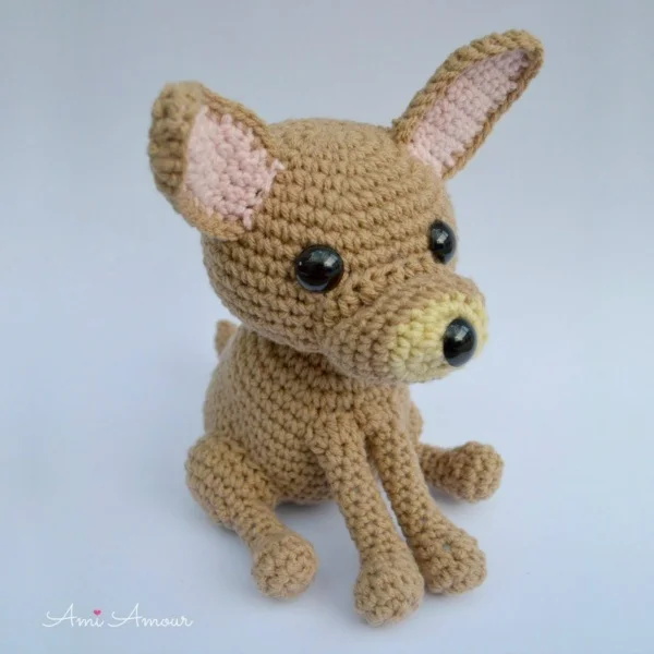 An amigurumi Chihuahua in a sitting position.