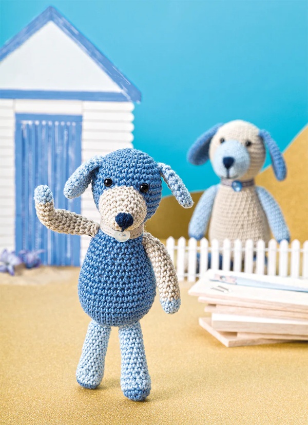A crochet version of Archie the dog from Shady Bay Island.