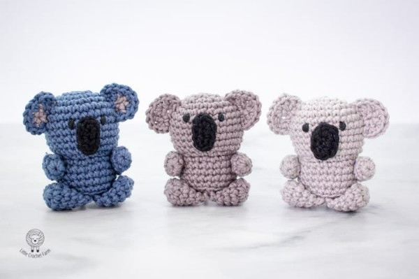 Three mini amigurumi koalas.