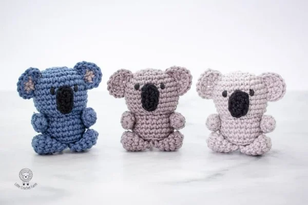 Three mini amigurumi koalas.
