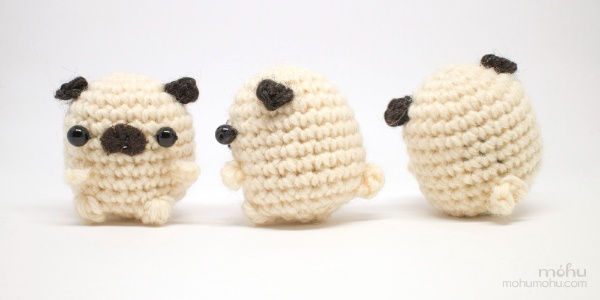 Front on , side, and back views of a small crochet Pug toy.