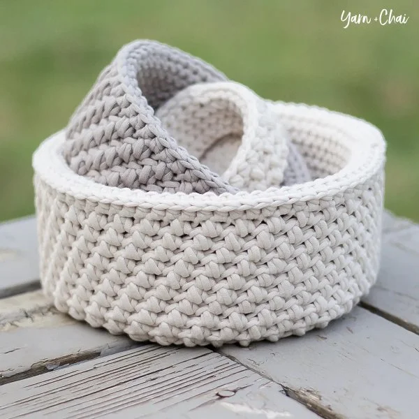 A set of mini crochet nesting baskets made up in neutral tones.