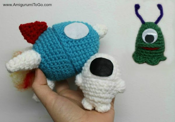Space-themed crochet egg cozies.
