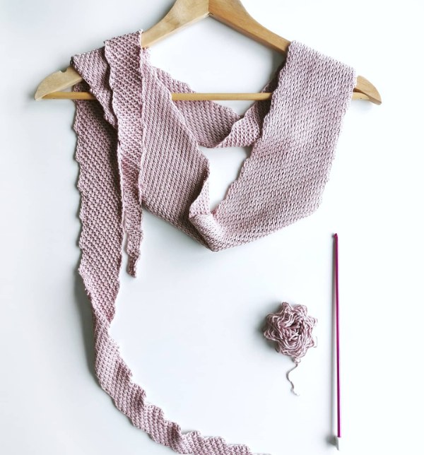 A narrow crochet scarf worked in Tunisian simple stitch.