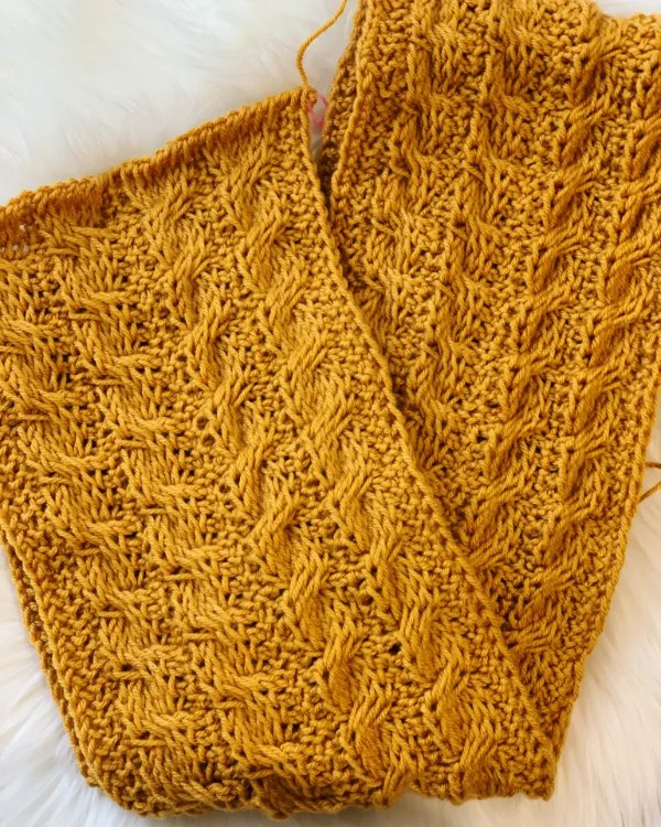A mustard coloured Tunsian crochet scarf worked in cable stitch.