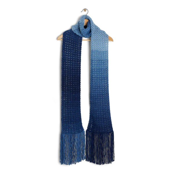 A blue Tunisian crochet scraf hanging on a wooden clothes hanger.