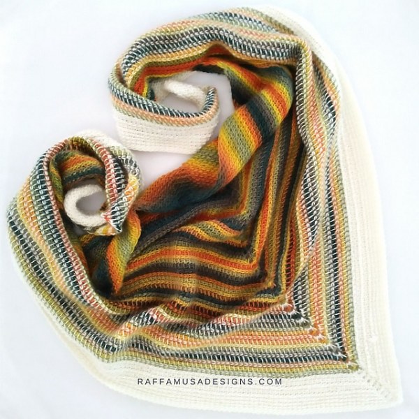 A flat-lay image of a striped, Tunisian crochet scarf.