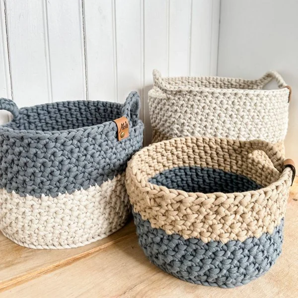Large, two-toned crochet nesting baskets.