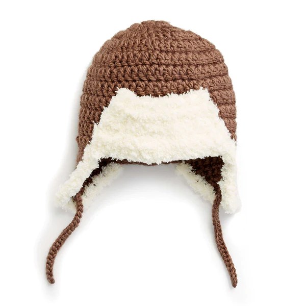 A flat lay image of a trapper-style crochet baby hat.