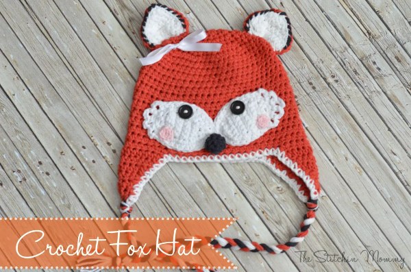 A baby fox-themed crochet earflap hat.