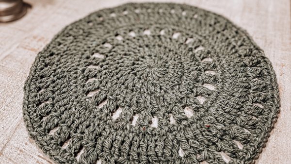 A round crochet placemat.