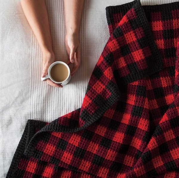 A black and red gingham crochet blanket.
