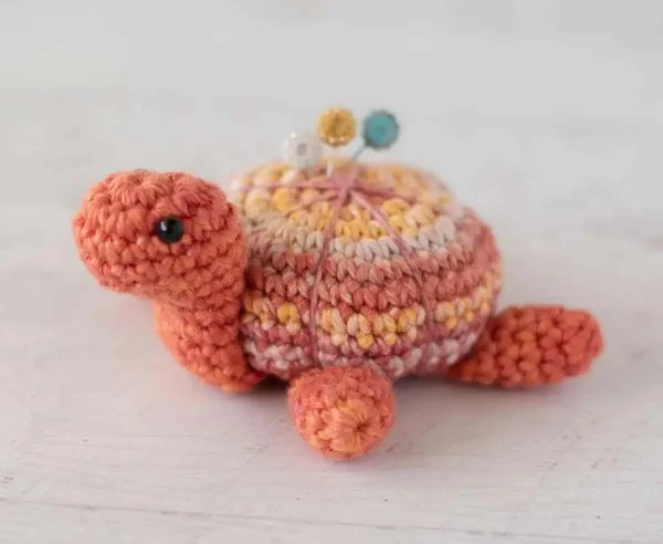 A crochet turtle pin cushion.