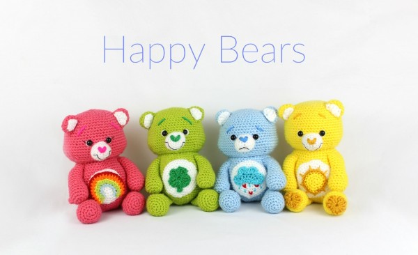 Four Care Bear-style crochet teddy bears.